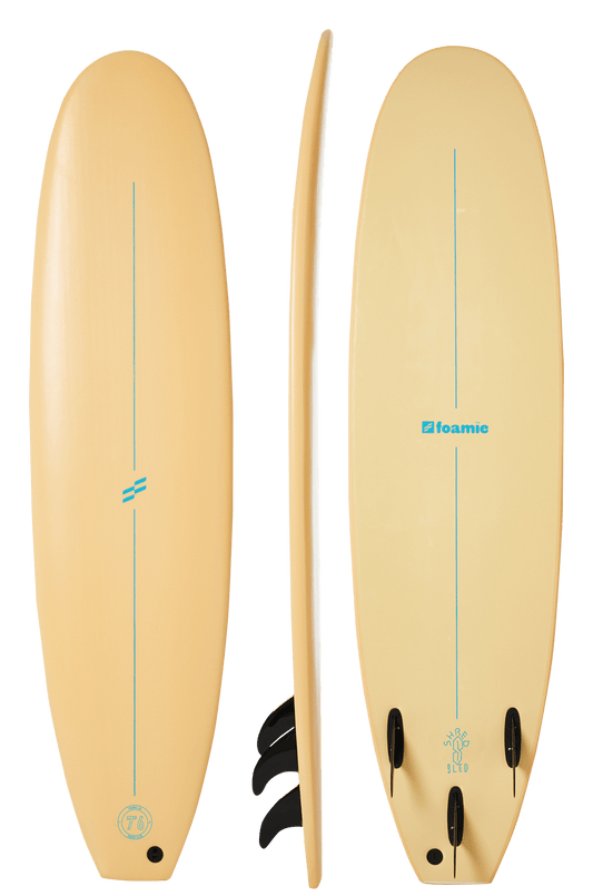 Foamie 7 foot 6 soft surfboard sand